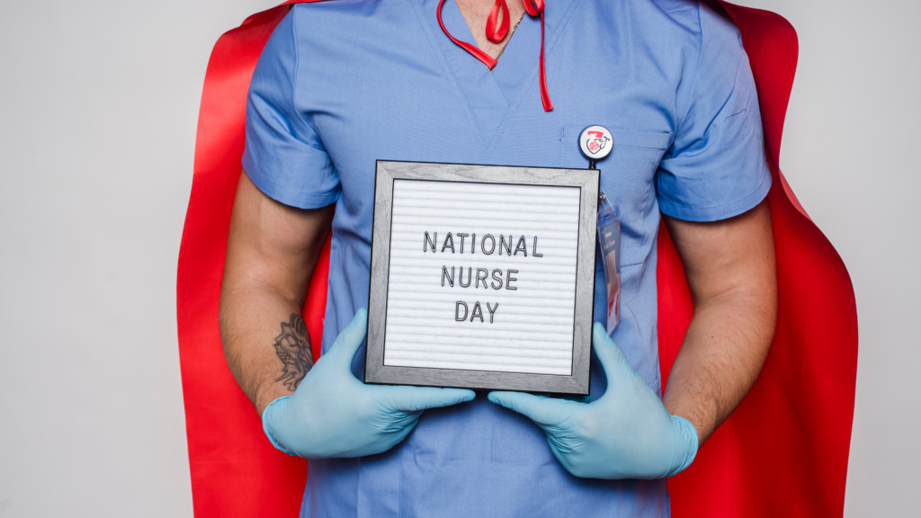 a nurse holding a national nurse day slogan